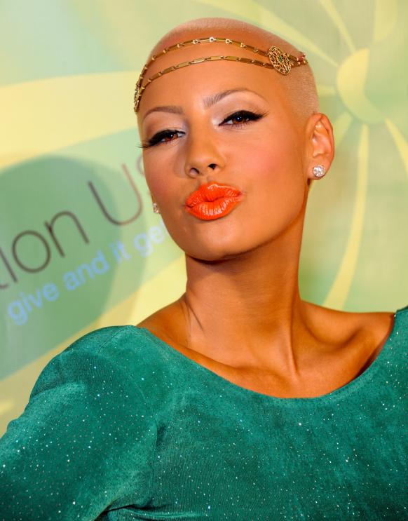 Amber Rose puckers up here at the Playboy Mansion