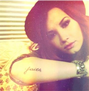 Demi Lovato Tattoo Pic The faith insignia is just the latest ink donned 