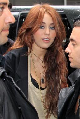 red hair looks good on
 on ... look below: What do you think of Miley's light red hair color? - Read