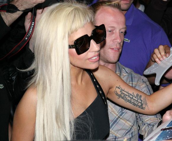 A closeup of the tattoo on Lady Gaga's arm She is one wild and crazy chica