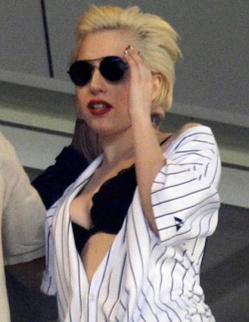 Lady Gaga displays her Yankees pride  and breasts.