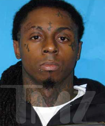 Lil Wayne in his latest mug shot Dude is totally relaxed about this one