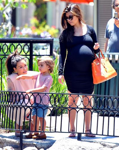 Pregnant Kourtney Kardashian and Mason