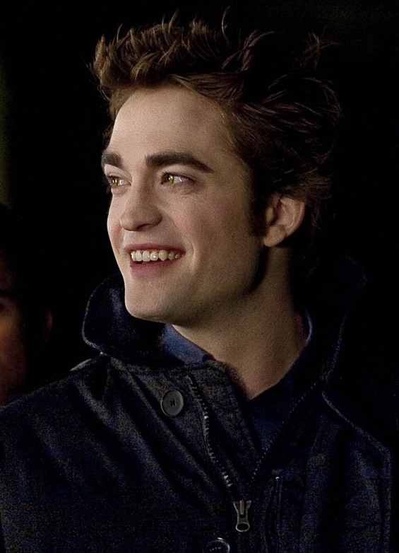 You don't see Robert Pattinson smiling very often. It's an awfully nice look 